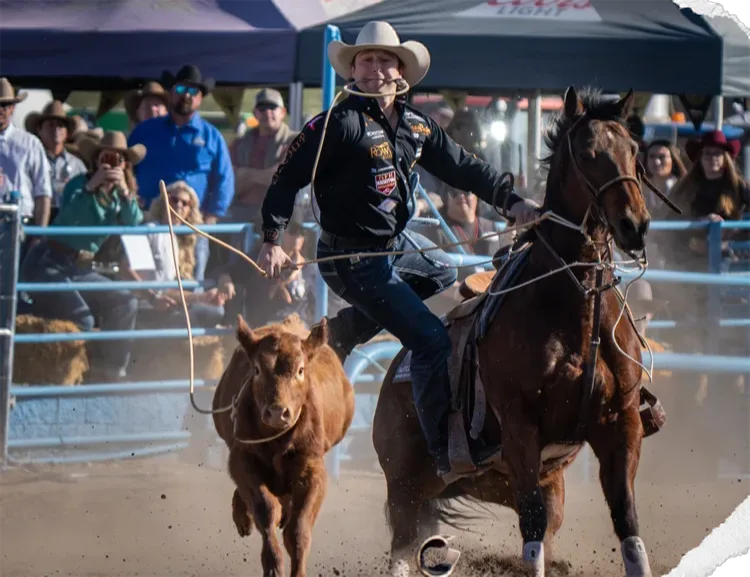Roper chasing a calf in a timed event
